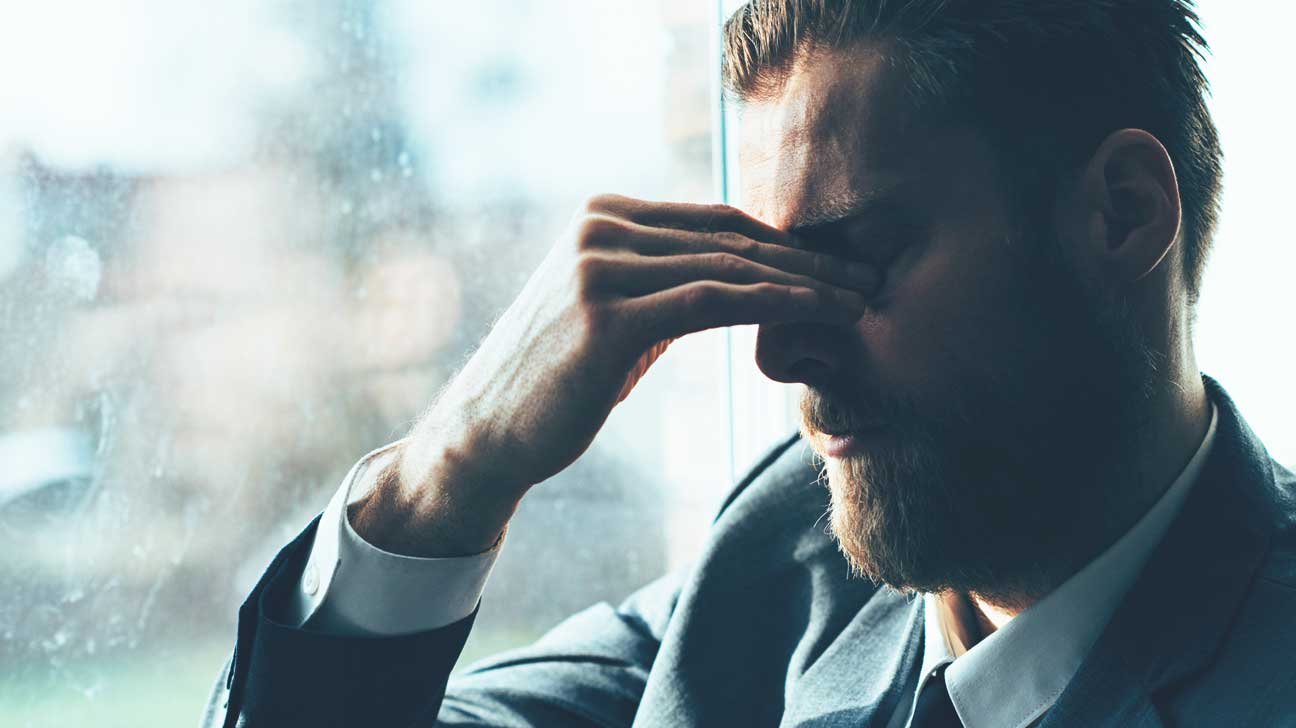 Man taking a moment during a stressful day
